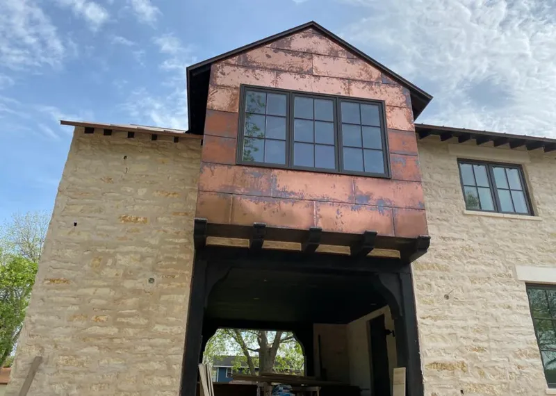 Copper metal panel facade on a stone building for Skylight Installation in Agoura Hills