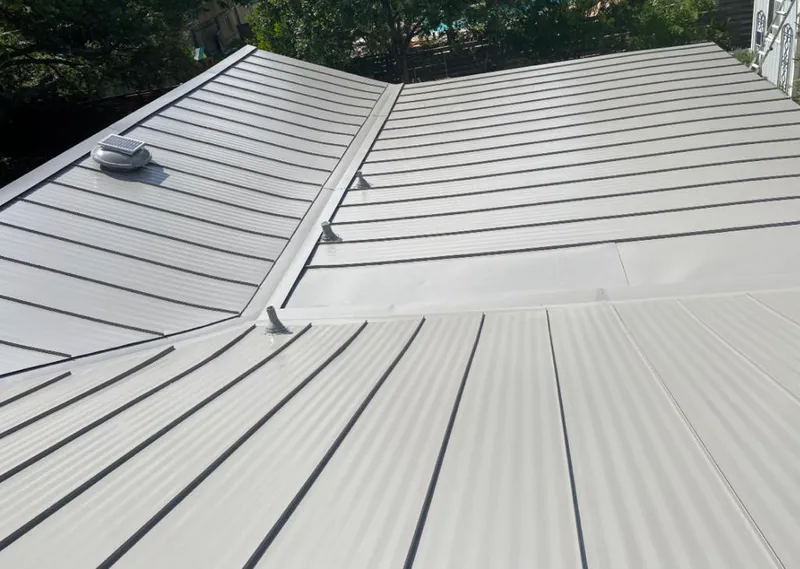 Solar attic fan installed on a metal roof for Roof Ventilation in Agoura Hills