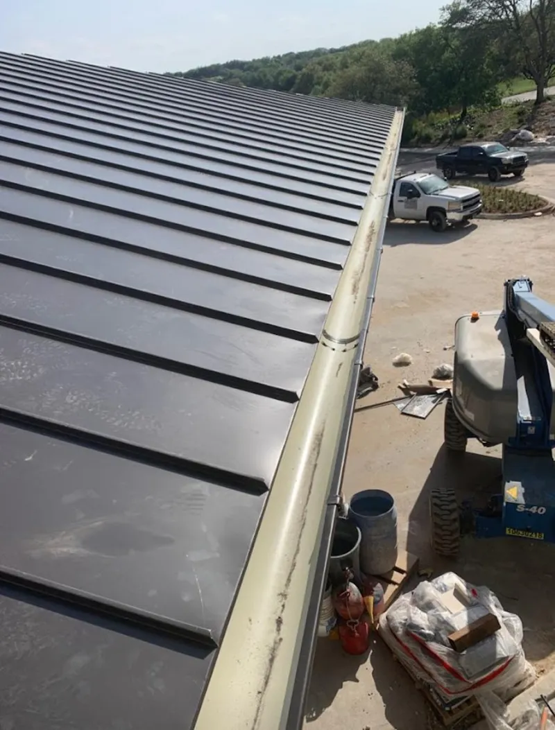 Standing seam panel and gutter detail on a metal roofing jobsite in Agoura Hills